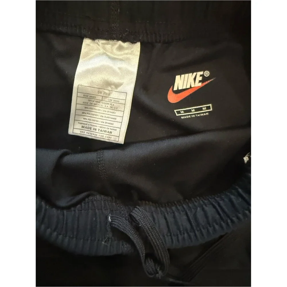 Nike womens small Black Track Joggers with White Swoosh